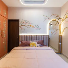 From hand-painted cherry blossoms to a ceiling that mirrors the sky, this cozy retreat is wrapped in warmth and imagination. The stunning arched mirror and soft tones are where dreams take flight.