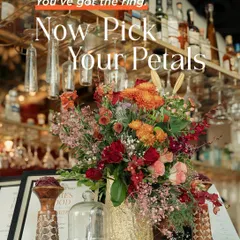 A beautiful floral arrangement at a bar, reminding us that every corner is an opportunity for beauty. We use fresh, vibrant flowers to add life and color to every part of the event space.