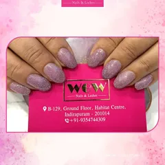 A perfect manicure results in flawless nails and soft hands. This look features a beautiful mauve glitter polish on perfectly shaped oval nails, showcasing a clean and polished finish.