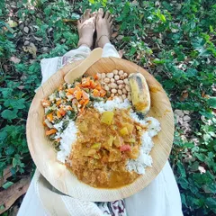 A simple, nourishing meal of rice, vegetables, and legumes served on a leaf plate at the Isha Yoga Center. Eating in this way, close to nature, makes you more sensitive to the food you consume and how it affects your system. It is a practice in mindfulness itself.