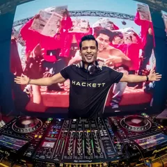 A full audio-visual set in action. Here, I'm mixing classic Bollywood movie scenes live on the big screen to match the energy of the track.