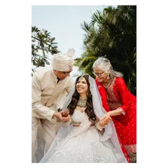 A priceless moment between the bride and her parents. Their joyful expressions and loving embrace make this one of the most heartwarming photos of the day.