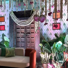 Another angle of the elegant seating area, showing the interplay of modern furniture with traditional Indian decor elements.