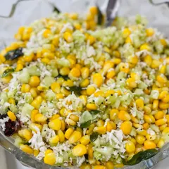 A close-up of a fresh corn and cucumber kosambari, a traditional South Indian salad. It's a refreshing and healthy dish that I often include in my menus.