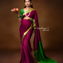 A full-length portrait showcasing the elegant drape of the saree and the classic pose that defines this artistic style.