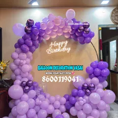 A full ring of purple balloons with a neon sign. This is a great option for a stylish yet simple birthday backdrop.