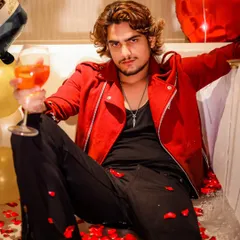 A stylized romantic shoot in a bathtub filled with rose petals. This is a great example of a themed shoot that can be used for music video covers, promotional content, or a unique portfolio piece.