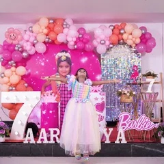 Pure joy and freedom at a Barbie-themed 7th birthday party. We capture the energy and excitement of the birthday star against their amazing themed backdrop.