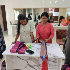 Two students working together during a practical session. I encourage a supportive environment where everyone learns from each other while mastering the art of saree pleating.