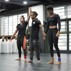 The referee raises her hand. A clear victory for Sheza, showcasing the skill and composure we build at ICSA.