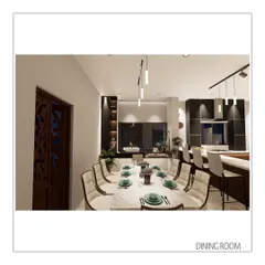 The dining room is positioned adjacent to the kitchen, creating an easy flow for entertaining. The elegant marble-topped table and sophisticated lighting make it a perfect setting for formal gatherings.