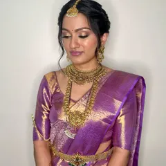 Intricate braids, flawless glam, and timeless elegance. This South Indian bridal look is complete with a shimmering eyeshadow and a perfectly set base that will last through the entire ceremony.