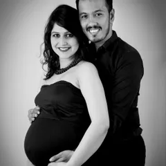 A beautiful black and white portrait of an expecting couple. The classic pose and monochrome finish give this image a timeless and elegant feel.