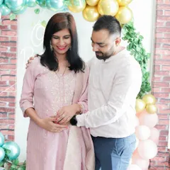 Capturing the shared look between a couple at their baby shower. These quiet, emotional interactions are just as important as the big, celebratory shots.
