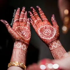 The rich, dark stain of an engagement mehndi, glowing beautifully during the ceremony. This is the color I always strive for, ensuring your hands look spectacular for your big event.