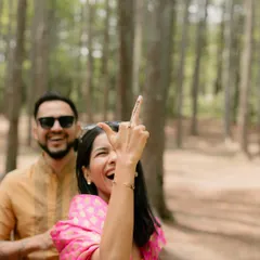A candid moment of pure fun and cheekiness during the Haldi celebrations. It's the unscripted, playful interactions that truly show a couple's personality.