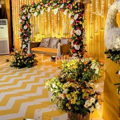 A closer look at the Teej stage, highlighting the magnificent floral peacocks. These sculptures, crafted from white flowers with cascading greenery for tails, added a touch of artistic elegance to the traditional decor.