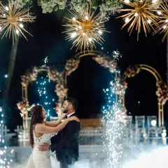 A first dance made magical with lighting and special effects. The combination of starburst chandeliers, spotlights, and cold sparklers created a truly cinematic and unforgettable moment.
