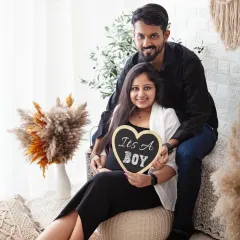 The parents-to-be are all smiles announcing they're having a boy. This photo in my boho setup is a wonderful way to share the news with family and friends.