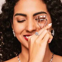 A playful and bright beauty shot for Aukera Jewellery. I used a classic winged eyeliner and a vibrant red lipstick to create a timeless look that highlights the model's smile and the intricate jewellery.