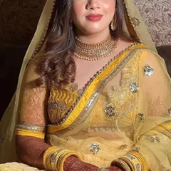 A portrait of a beautiful bride, Saniya, showing off the lovely dark stain of her mehndi on her wedding day.