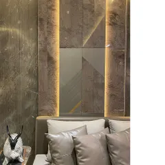 Detail of a wall panel behind a headboard, featuring a geometric composition of wood veneer, matte panels, and vertical lighting strips. This is how we turn a simple wall into a piece of architectural art.