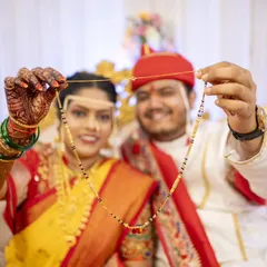 The couple proudly displays the 'mangalsutra', a beautiful symbol of their new union as husband and wife.