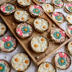 For this custom wedding order, the client requested a mix of pastel and classic white daisy designs. The result is a beautiful assortment of handmade Urli candles, perfect for guest favors.