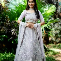 A beautiful lavender lehenga with all-over silver embroidery and mirror work. This outfit is light and sparkly, perfect for daytime events and outdoor photoshoots.