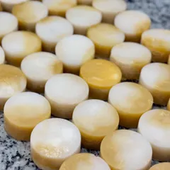 The beautiful, pearlescent swirl in our custom champa-scented loofah soaps. These were part of a large order of baby shower favors delivered to Bangalore.