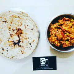 This is a classic Kathiyawadi combination: smoky Ringan no Oro (roasted eggplant mash) served with a traditional Bajri Rotlo (millet flatbread). It's a wholesome and delicious meal option.