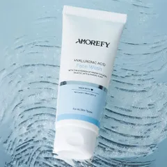 A texture shot of a hyaluronic acid face wash on a rippled, water-like surface. This visually communicates the product's hydrating properties in a clean and modern way.