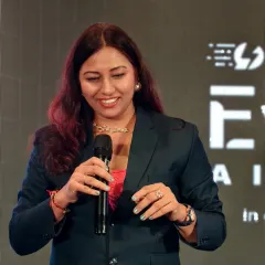 A close-up shot from the Evolve AI summit, showing my focus and engagement while hosting. I listen intently to every speaker, ensuring smooth transitions and a connected experience for the audience.