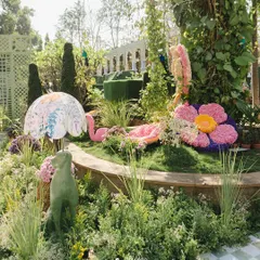 A wide view of the enchanted garden setting, where I used floral sculptures of a flamingo and other animals to create a vibrant and lively atmosphere.
