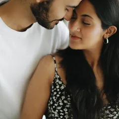 These are the quiet moments I cherish the most. The gentle touch, the shared breath, the feeling of being completely connected before your world changes forever. It’s about capturing the love that started it all.