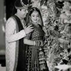 A classic black and white portrait of the couple, highlighting the emotion and connection between them.