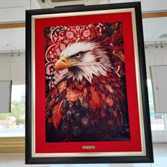 A majestic eagle rendered in the unique style of carpet painting by Fannan Raaz. The intense gaze and detailed feather work are a testament to his skill.