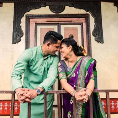 The intricate woodwork and classic architecture of a heritage wada create a warm and intimate frame for this couple's portrait. It’s a perfect blend of romance and tradition.