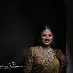 Pooja's bright smile shows her confidence and joy. The complete look, with diamond jewelry and a chic hairstyle, is perfect for a modern reception.