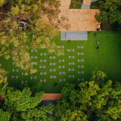 An aerial view of the 'Founders Peak' yoga retreat hosted here. My expansive lawn is perfect for large-scale wellness events.
