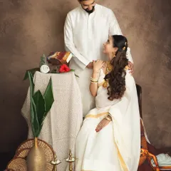 I have a special place in my heart for traditional shoots. Here, a couple is styled in classic white attire for a Keralan-themed session, creating a portrait that feels like a timeless painting, rich with cultural heritage and love.