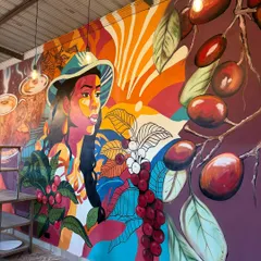 This vibrant, full-wall mural was designed for a cafe space, telling the story of coffee from bean to cup. It shows how I can use bold colors and illustrative styles to create an energetic and welcoming atmosphere for customers.