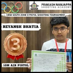 Another one of our young achievers, Reyansh Bhatia, proudly displays his certificate and bronze medal from the CBSE South Zone II Pistol Shooting Tournament.