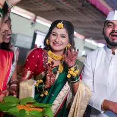 The bride's joyful expression during her Haldi ceremony, surrounded by friends and family. These are the candid moments of pure happiness we love to capture.
