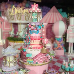 This is what a first birthday dream looks like. I designed this entire carnival-themed dessert table for little Dhitya, featuring a multi-tiered centerpiece cake with a ferris wheel and carousel, surrounded by custom cupcakes, macarons, and cakesicles.