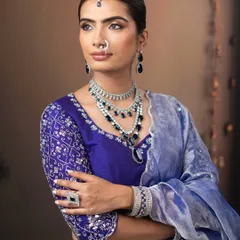 This look showcases how to pair bold colors like royal blue with elegant, radiant makeup for a balanced and beautiful result.
