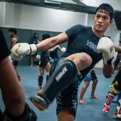 A fighter executes a powerful kick during a training session. We focus on developing explosive and precise striking for all our athletes.
