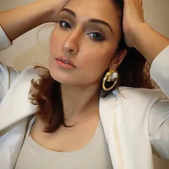 Here I am modeling the gorgeous brass hoop earrings with a crystal element. They are perfect for adding a touch of drama to a simple blazer look.