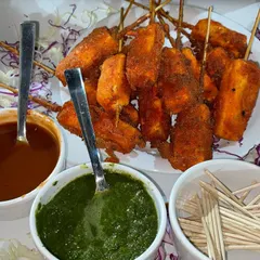A platter of our crispy fried Paneer Tikka, served with traditional green chutney and tangy tamarind chutney. This is a perfect appetizer to get any party started.