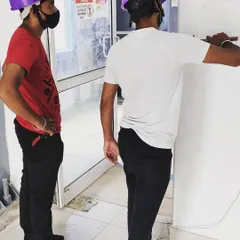 Teamwork is key to a smooth installation. Our technicians collaborate to map out the wiring and positioning for a door access system, ensuring a clean and functional setup at the main entry point.